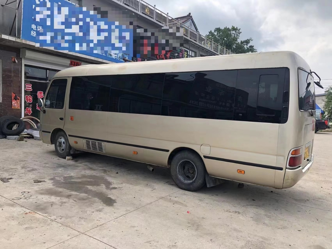 Toyota Mini Used Coaster Bus With salió puerta del pasajero de 23 asientos 1Hz motor diesel