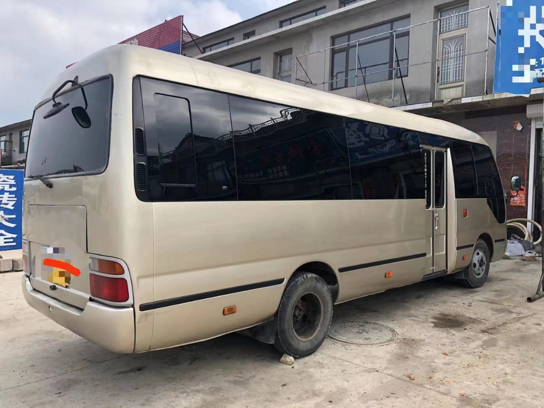 Toyota Mini Used Coaster Bus With salió puerta del pasajero de 23 asientos 1Hz motor diesel
